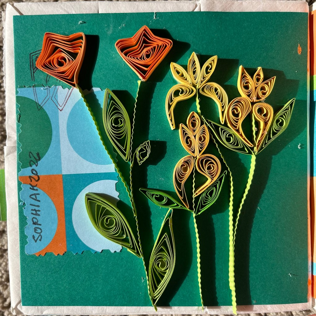 paper quilling of flowers, the lighting casts a shadow on the paper