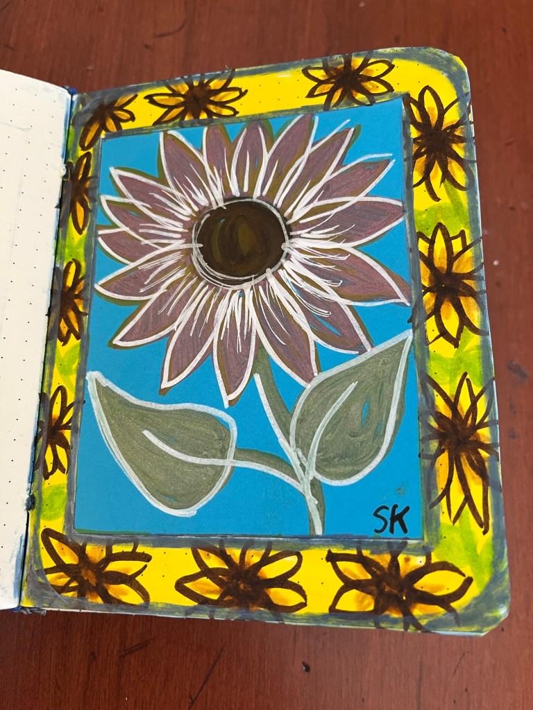several sunflower drawings surrounding a larger red sunflower