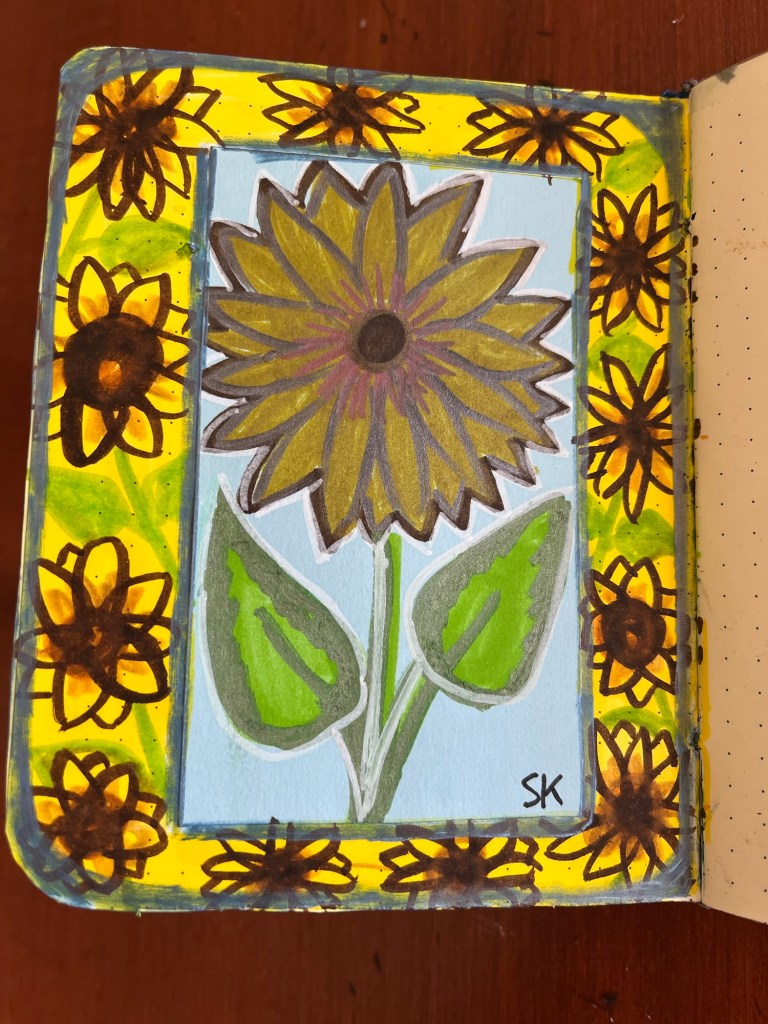 several smaller sunflowers surrounding a larger sunflower drawing