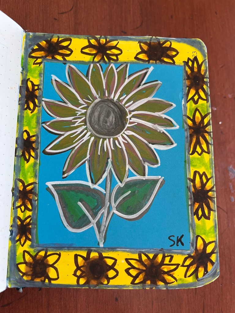 several smaller sunflowers around one larger sunflower drawing
