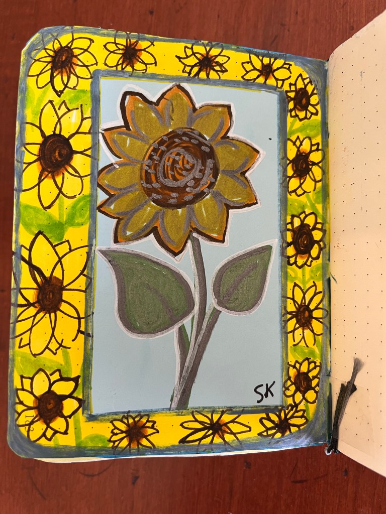 several smaller sunflowee drawings surrounding one larger sunflower