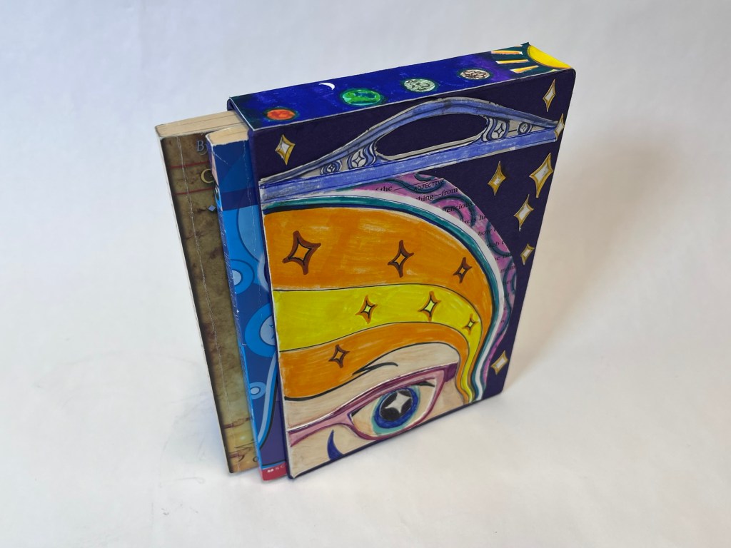 drawing of sophia on a slipcase, on top of the slipcase is an image if the solar system