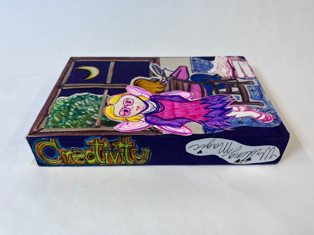 another view of the slipcase, showing the title of the two books "creativity" and "writing magic"