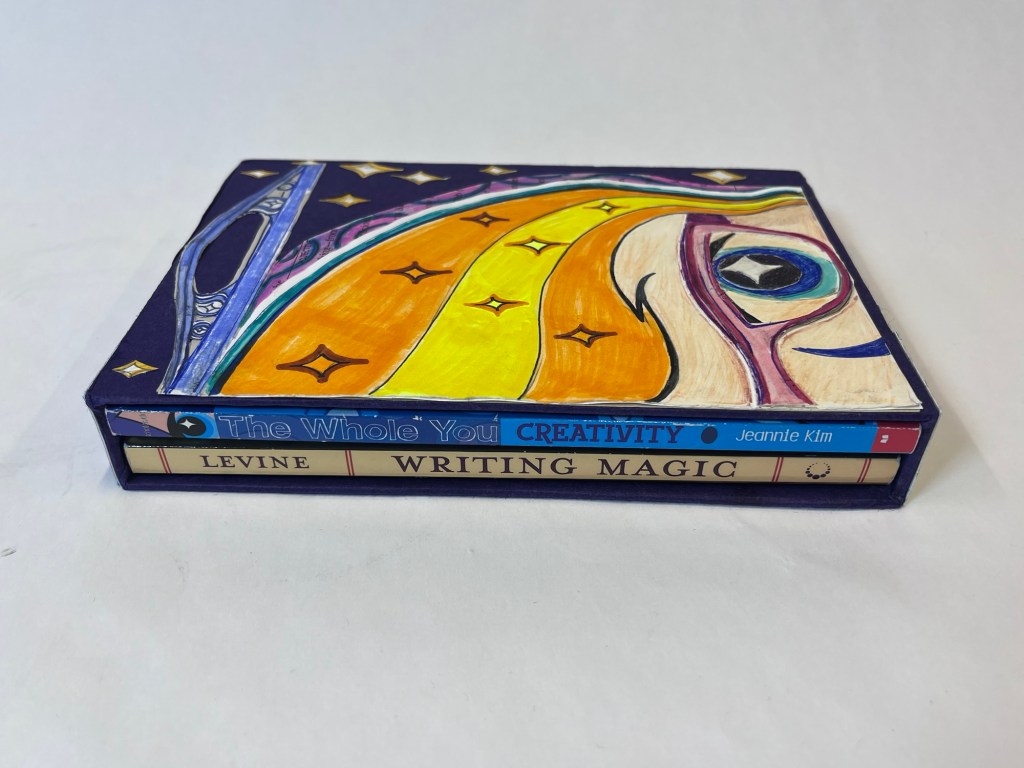 another view of the slipcase showing the spine of the books "creativity" and "writing magic"