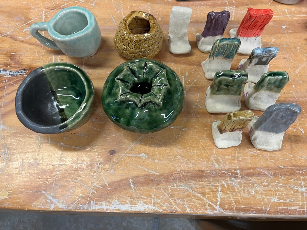 a boel, a mug, and two planters, plus nine glaze test tiles