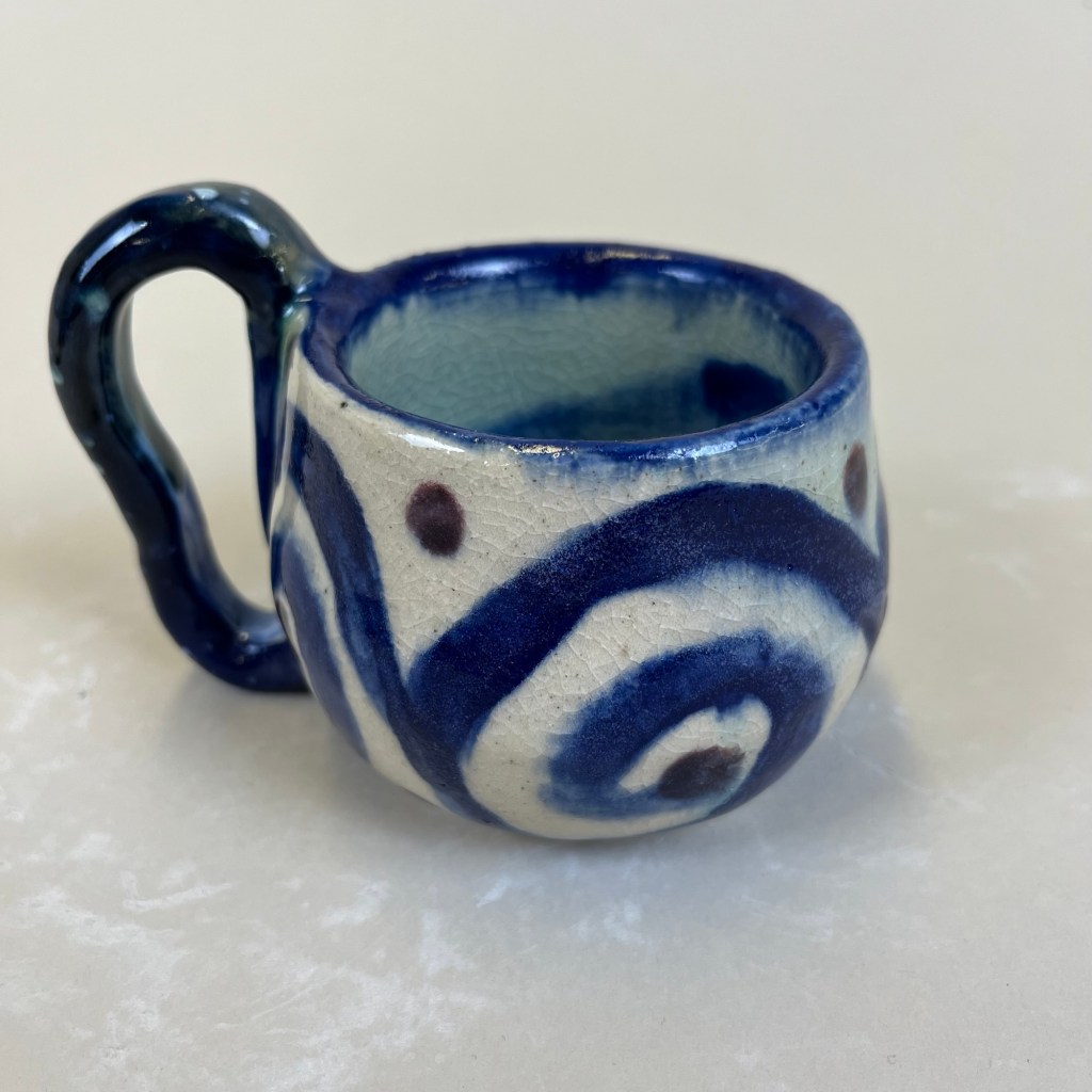 blue mug with swirly patterns